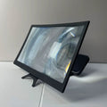 Black plastic curved screen magnifier with a sleek frame and integrated stand, designed for enhanced smartphone viewing.
