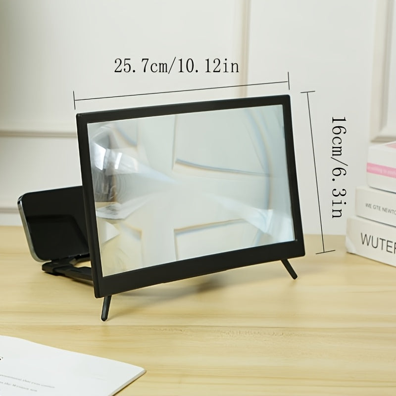 Black 12-inch HD phone screen magnifier with clear projection screen and foldable stand on a wooden desk.