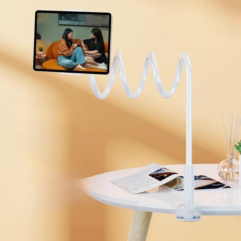 White ABS tablet stand with a thick, coiled flexible gooseneck arm, clamping to a table and holding a device.