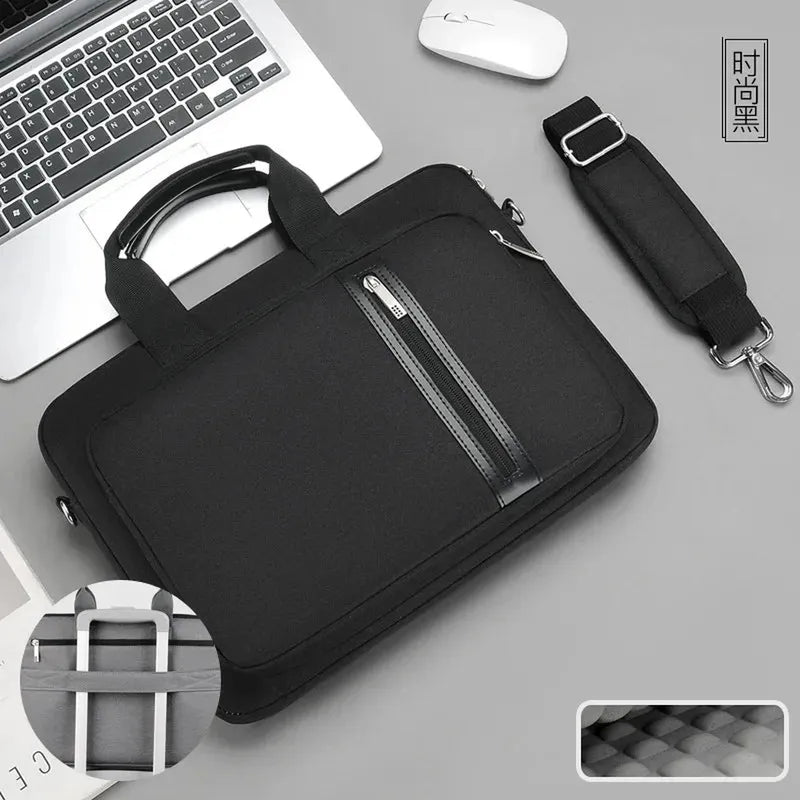 Black polyester laptop messenger bag with top handles, zippered front pocket, and detachable shoulder strap. Padded for 13-17 inch laptops.