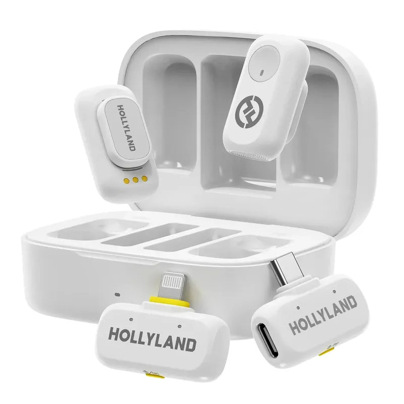 White Hollyland LARK A1 wireless microphone kit with open charging case, two floating transmitters, and separate Lightning/USB-C receivers.