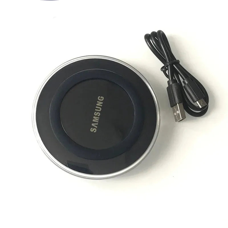 Black Samsung EP-PG920I circular Qi fast wireless charging pad with silver trim and coiled micro USB cable.