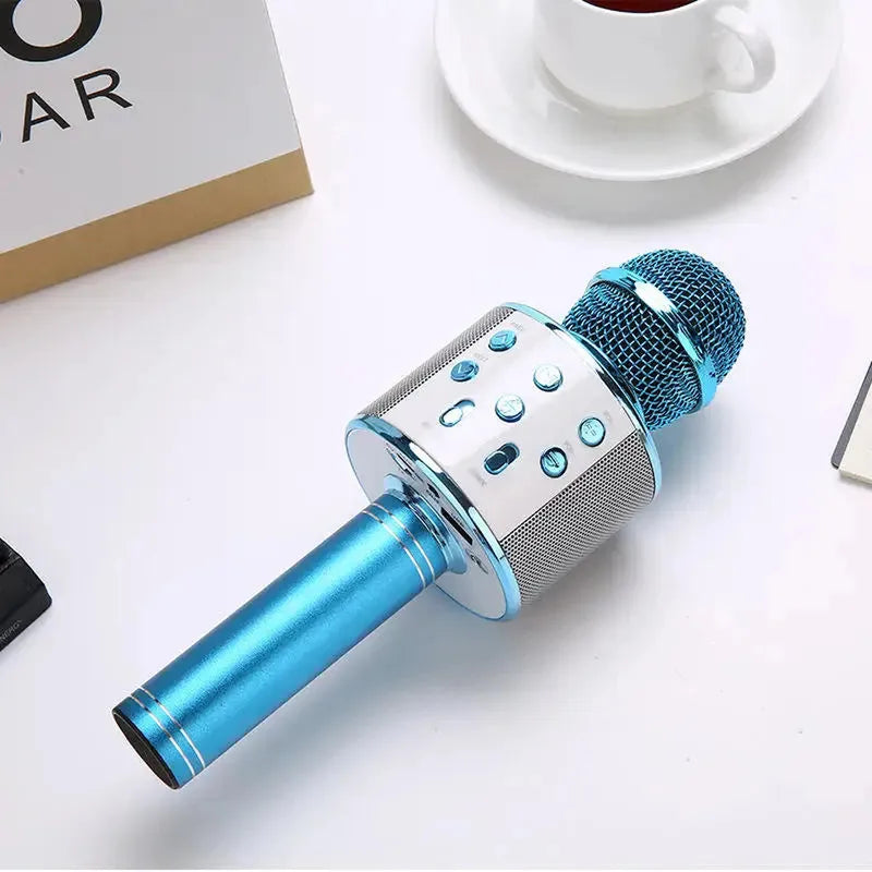 Portable metallic blue wireless karaoke microphone with silver control panel, built-in Bluetooth speaker, and multi-function buttons.