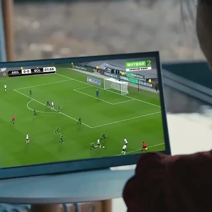12-inch dark-framed screen magnifier displaying a football game. Foldable phone stand with high-definition projection for smartphones.