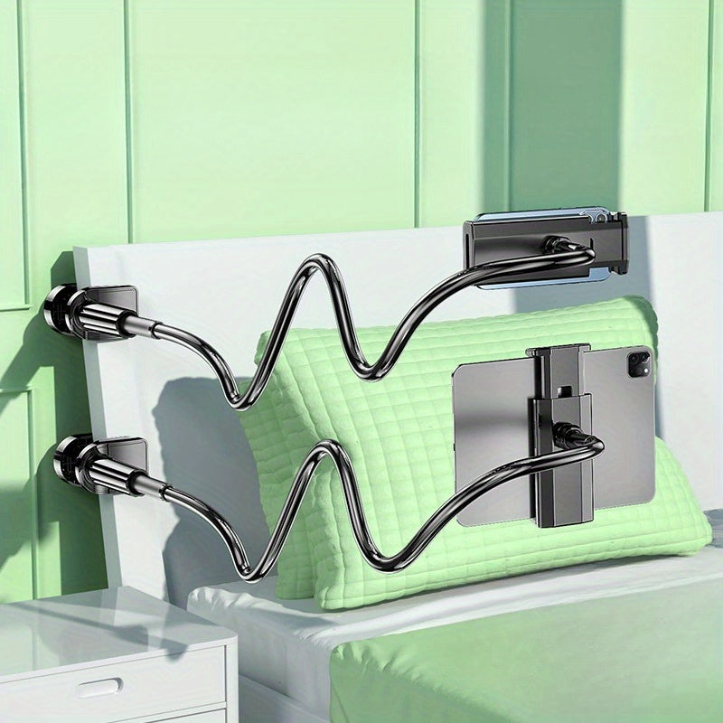 Flexible dark gray gooseneck tablet and phone stand with dual device holders, clamped to a white headboard.